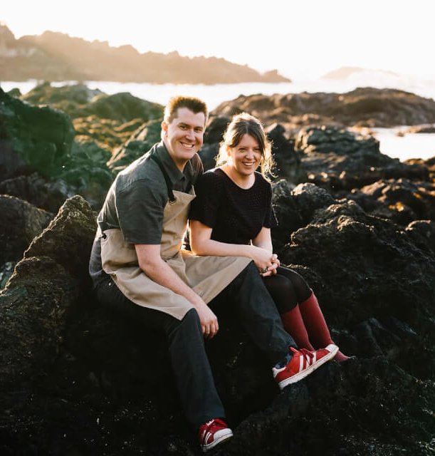 man and woman on rock