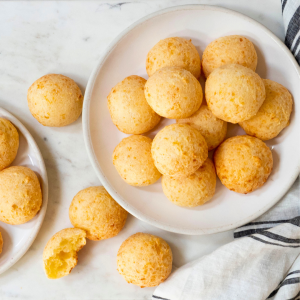Small round cheese buns on white marble board
