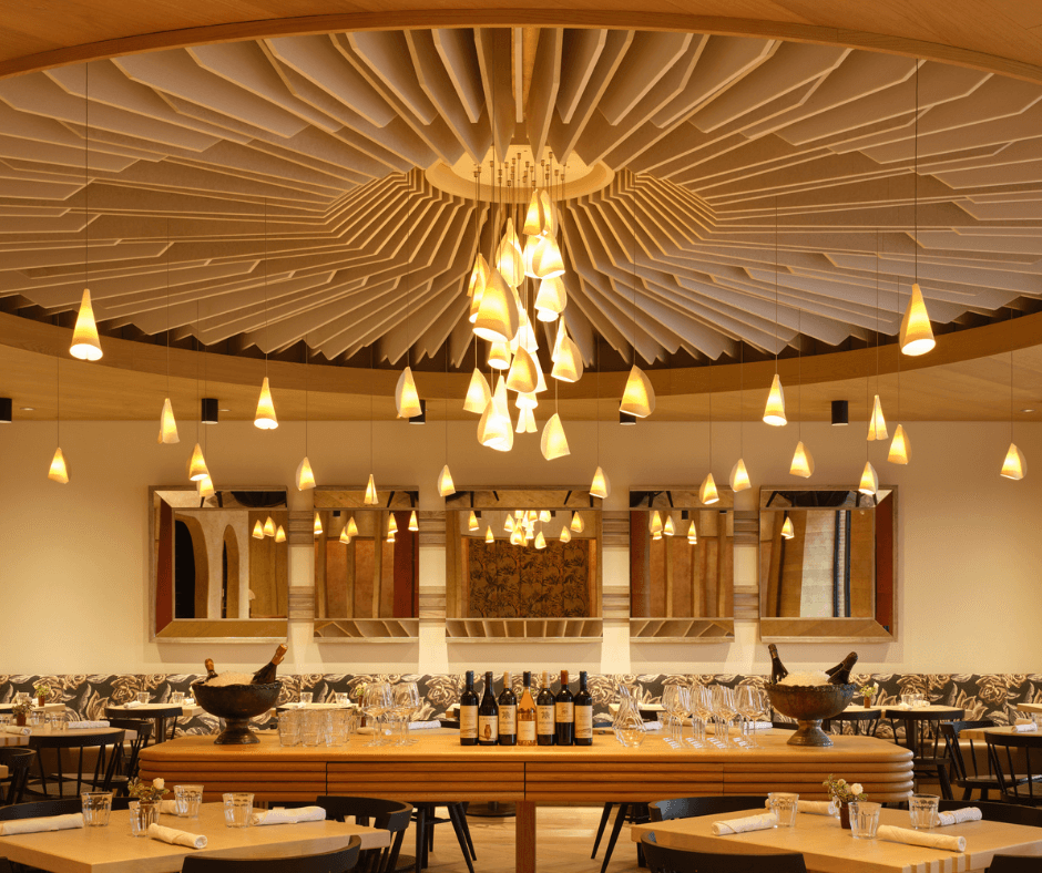 dining table under architectural chandelier