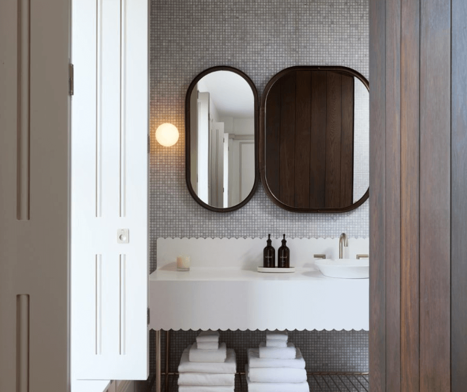 Looking at marble bathroom vanity through doorway