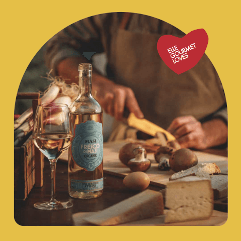 Wine bottle on table with wine glass