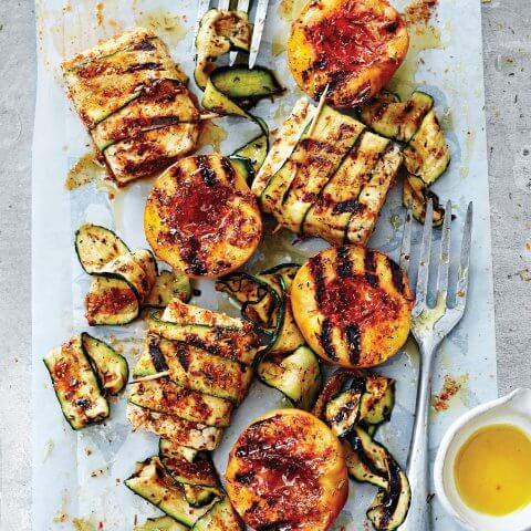 Zucchini parcels and forks arranged on a pan.
