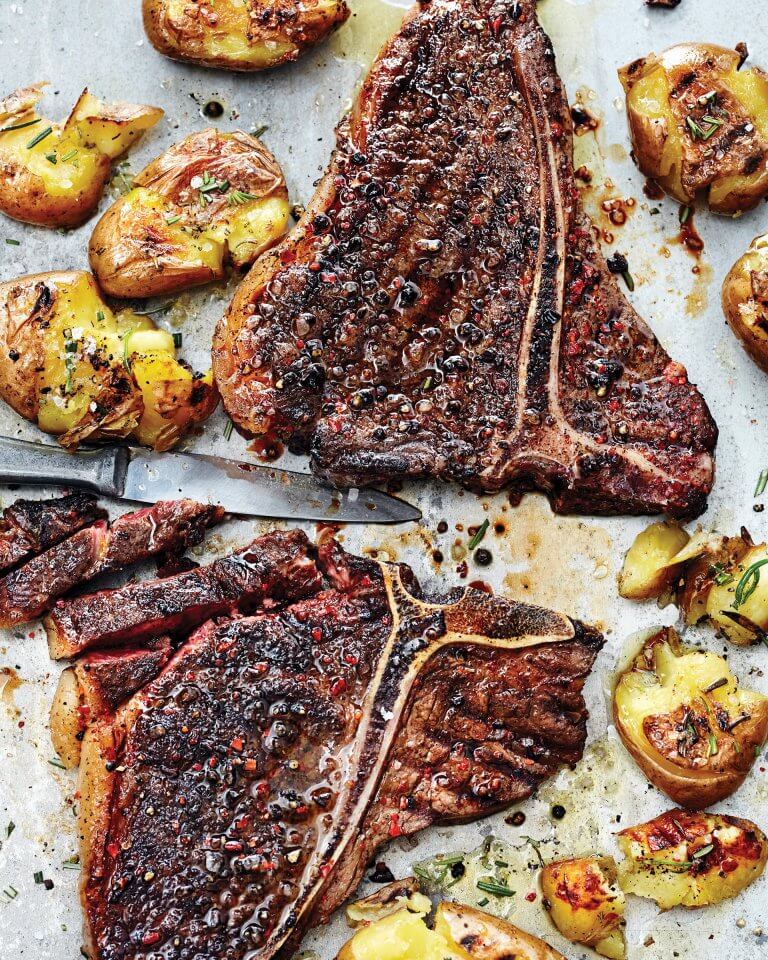 Grilled T-bone steak with chili coffee rub served with crispy smashed potatoes.