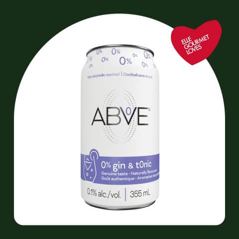 A white and purple can in a dark green frame