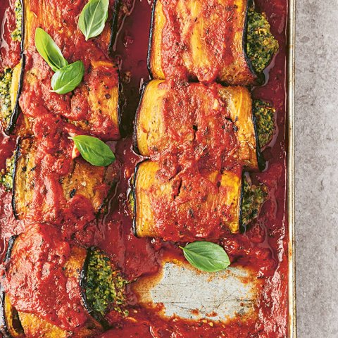 A pan and dish with baked eggplant