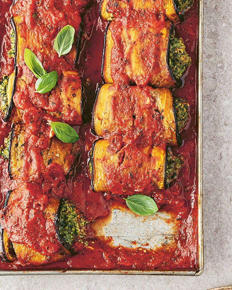 A pan and dish with baked eggplant