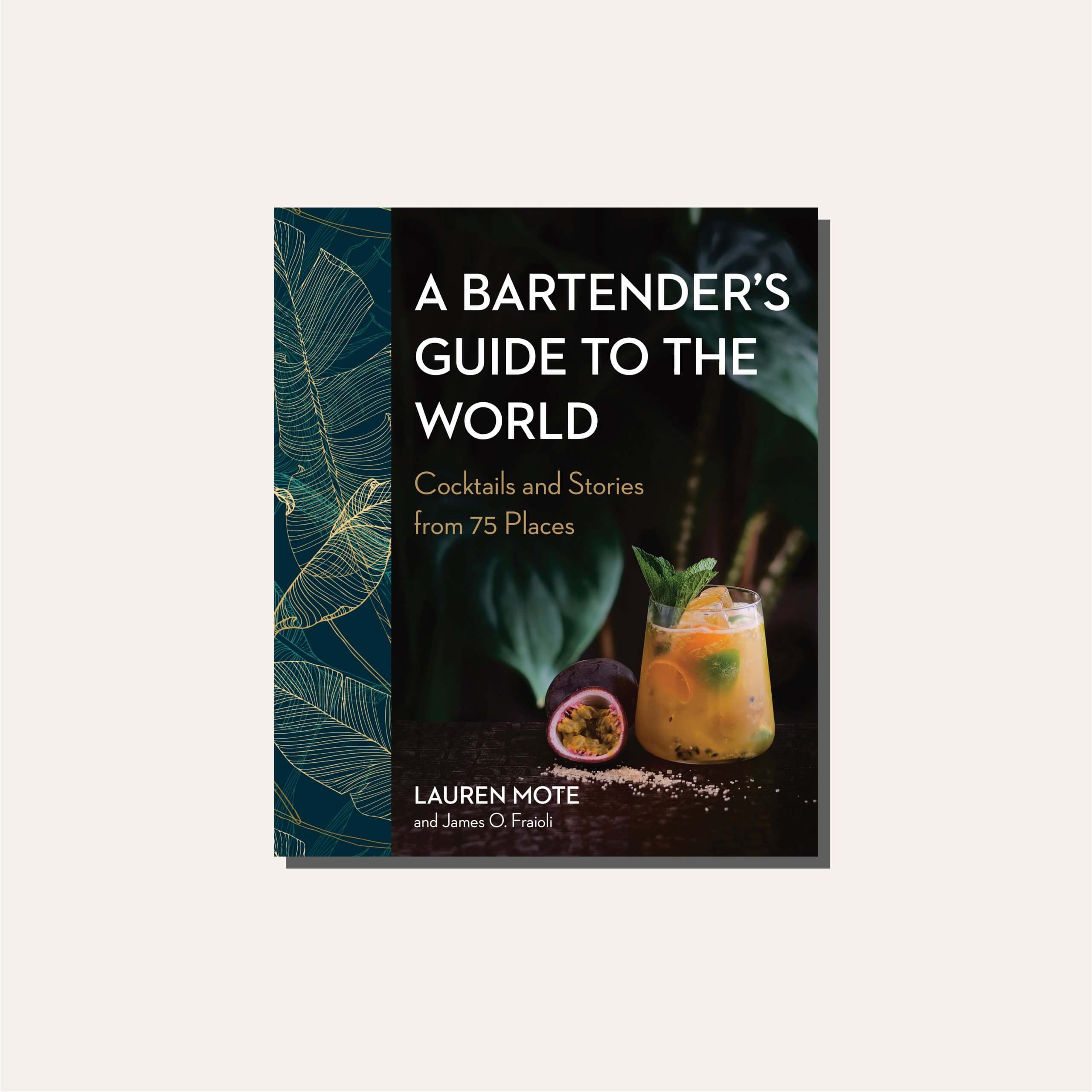 A dark green cookbook on a cream background