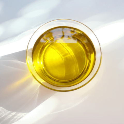 overhead glass of yellow liquid