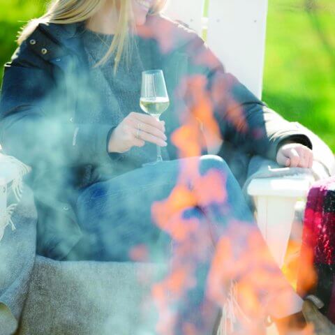 woman holding wine glass folder