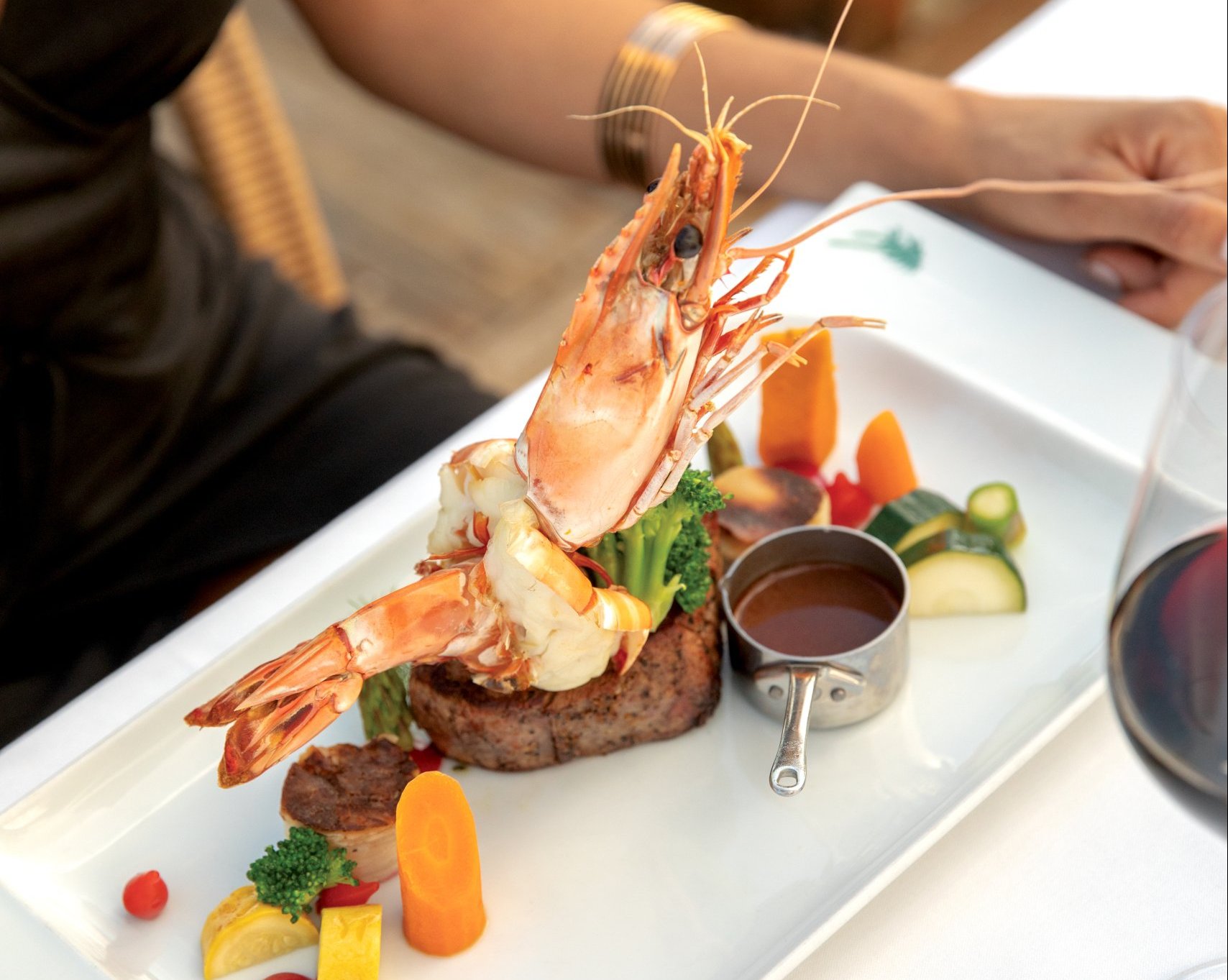 A long white plate with artfully arranged food