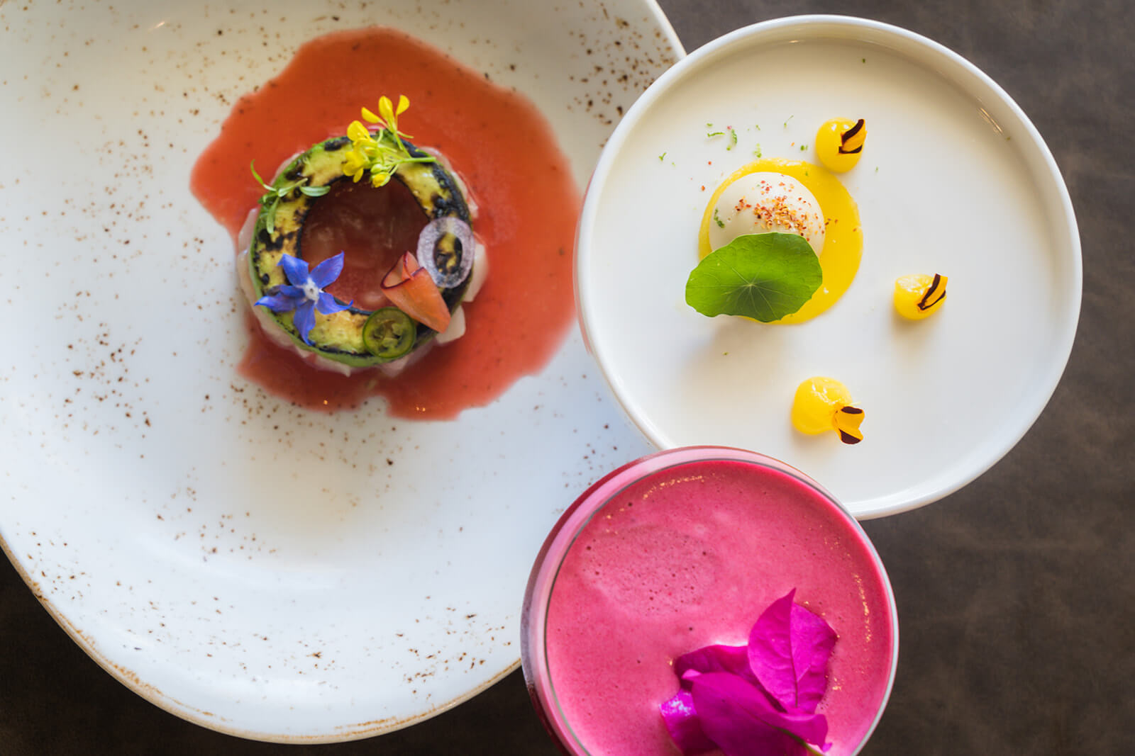 three pretty plates with colourful food
