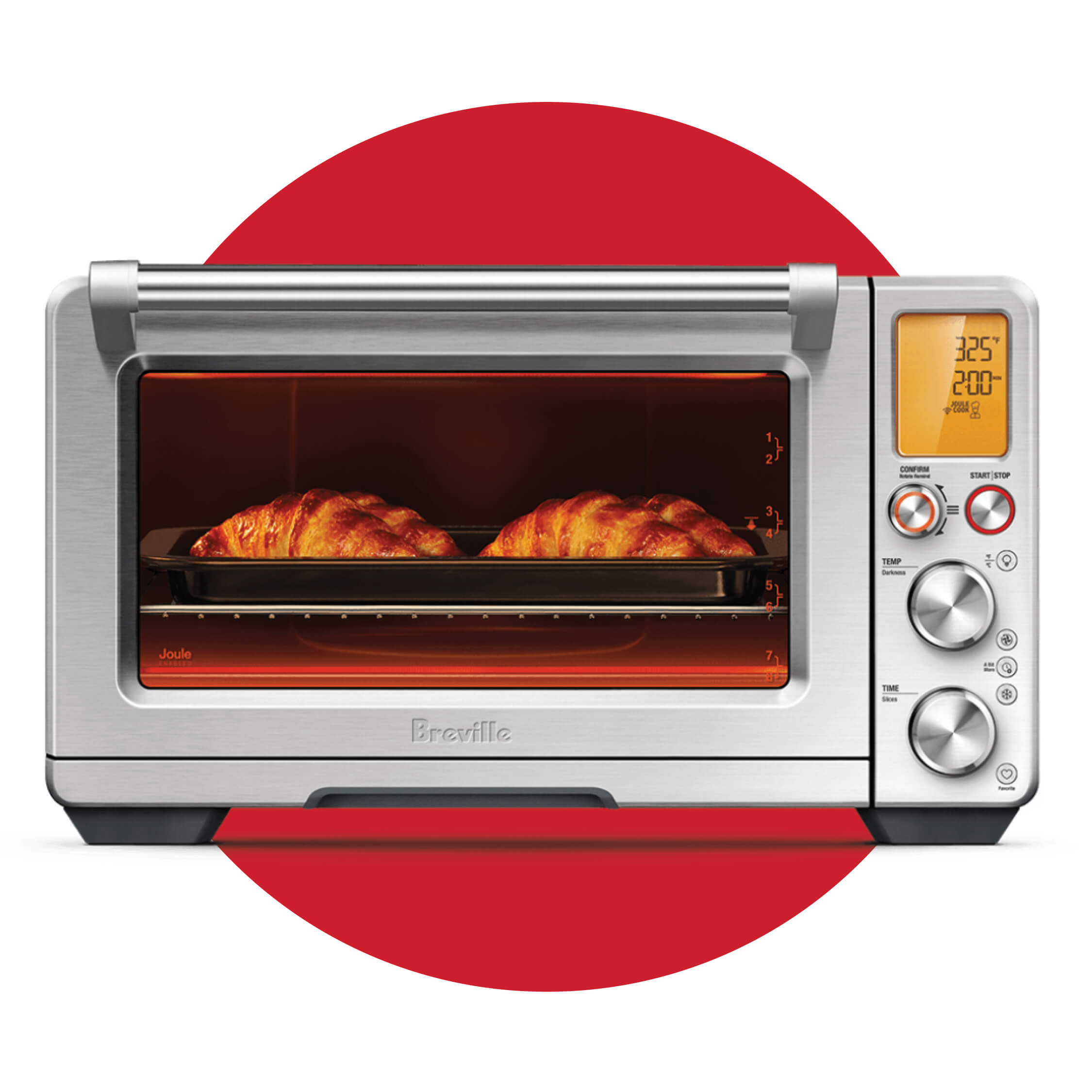 A silver air fryer on a red circle