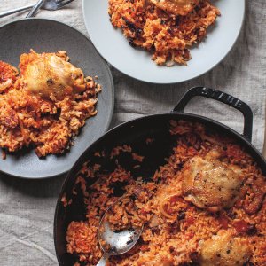 A pan with an easy one-pot recipe for a rice, chorizo and chicken thighs