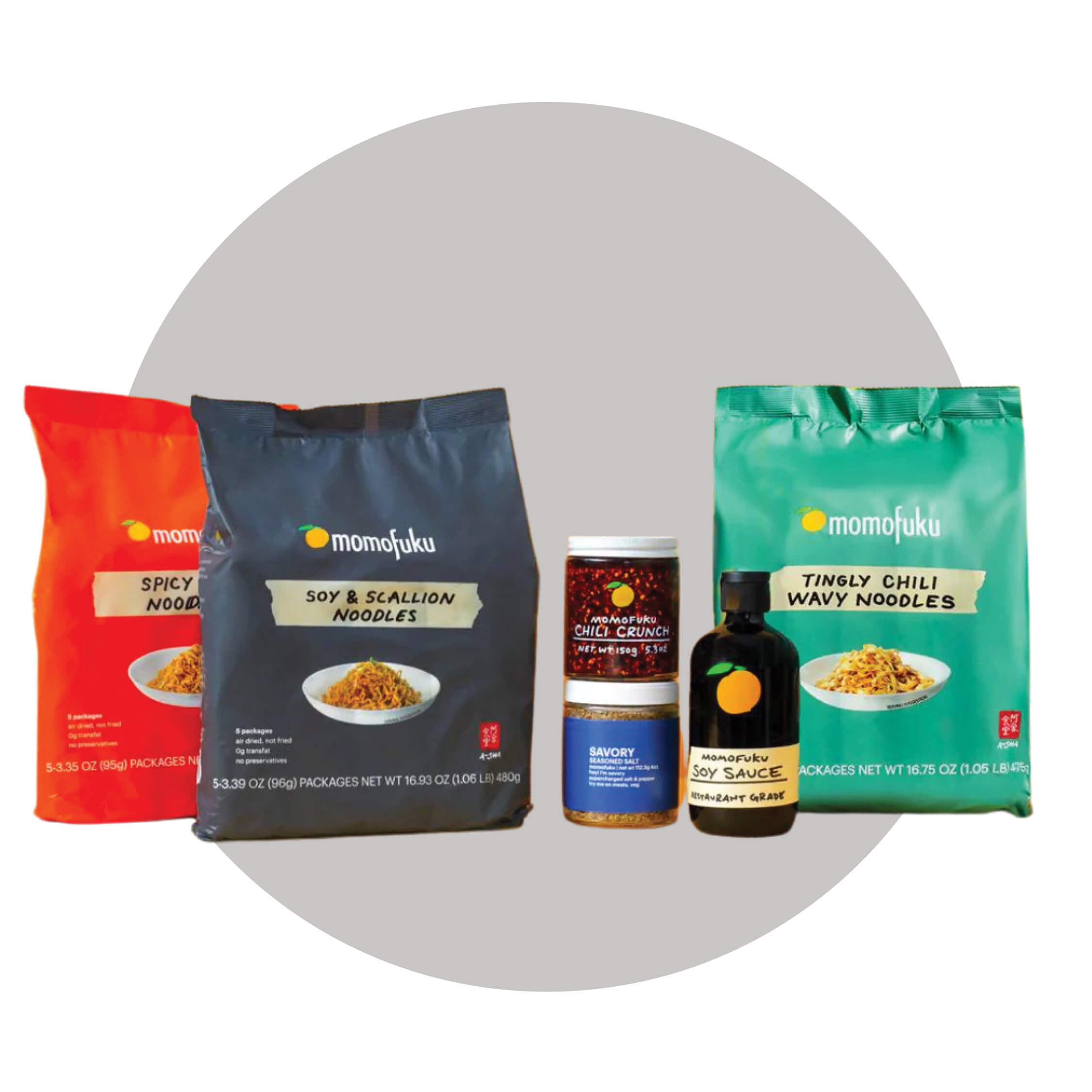 Three bags and three bottles on grey circle