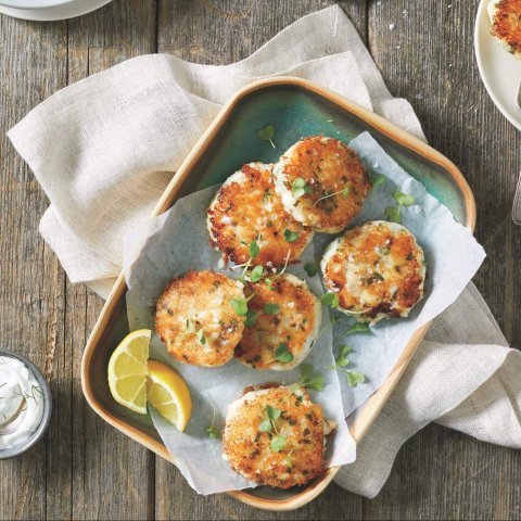 tray of fishcakes with lemon slices