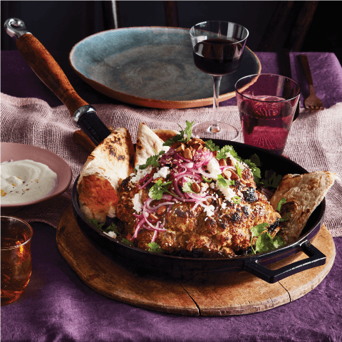 roasted cauliflower in cast iron pan on table