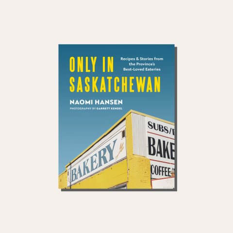 A blue and yellow cookbook in a light frame.