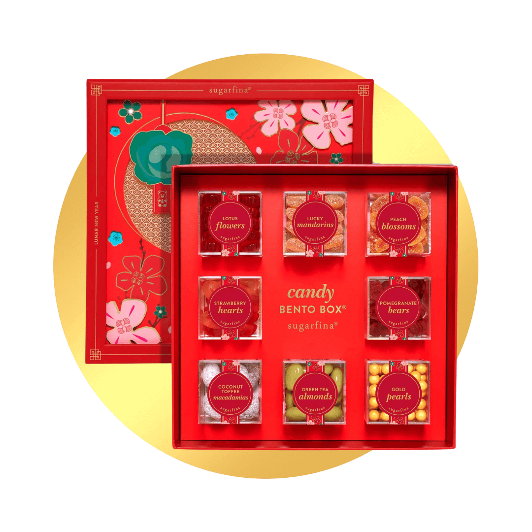 A red candy box with 8 different boxes on a gold circle.
