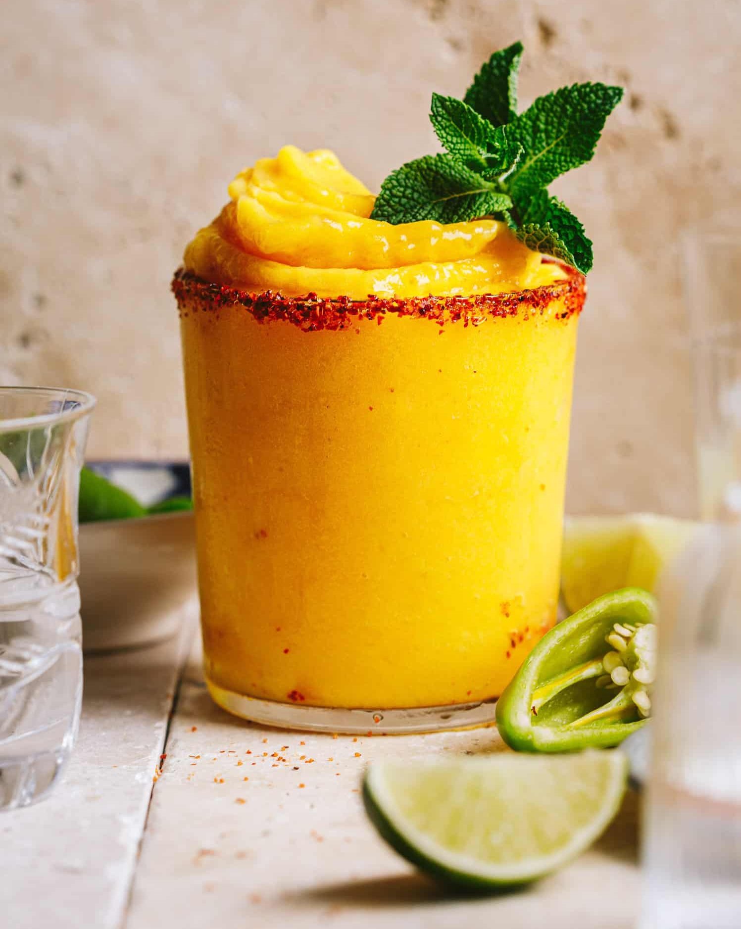 A frozen orange drink on a wooden tabletop.
