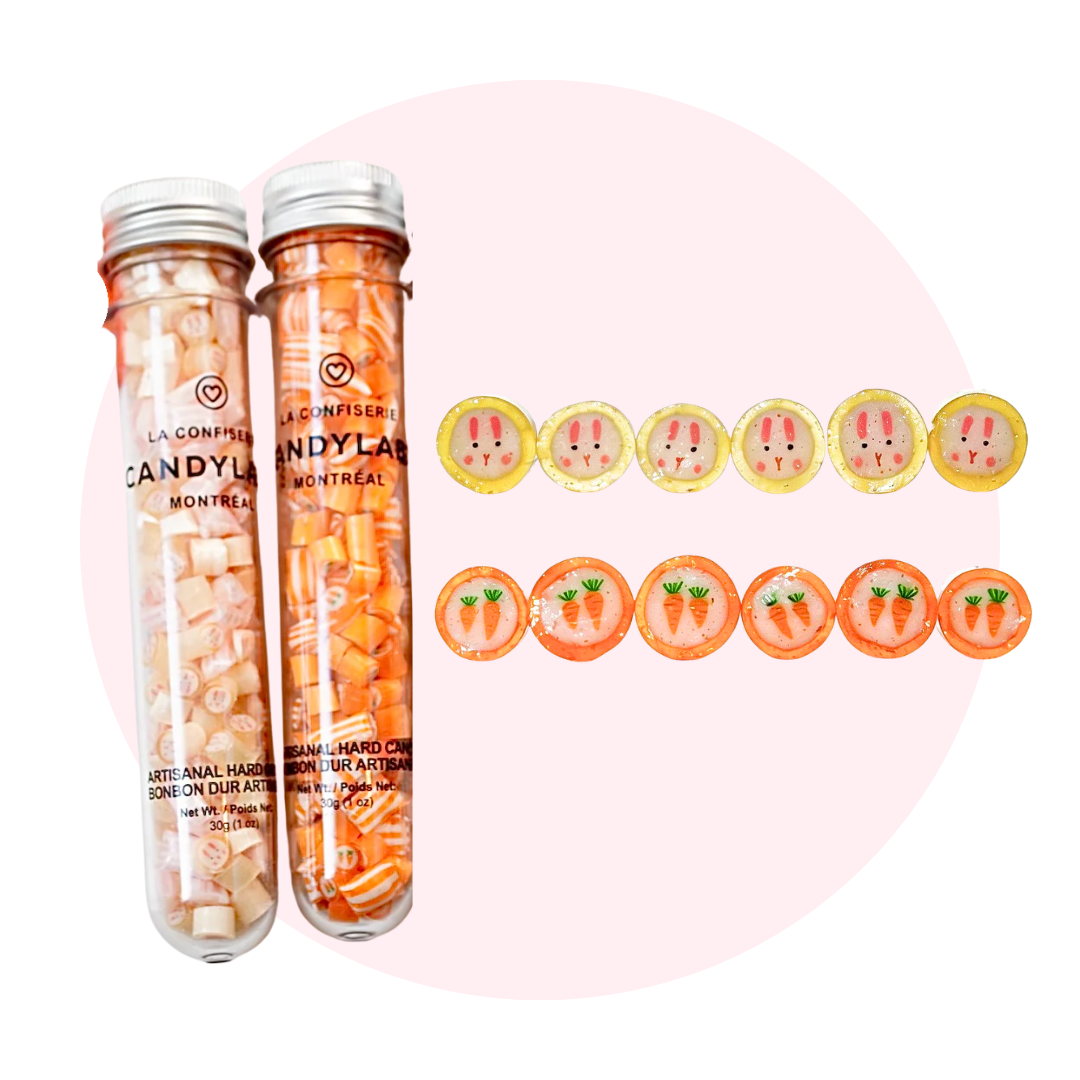 Two test tubes filled with yellow and orange cut rock candy. 