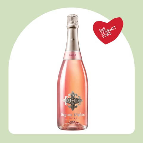 A bottle of Segura Vidas Brut Rose in a light green frame.