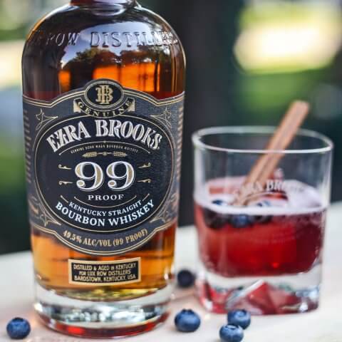 A bottle of Ezra Brooks bourbon and a glass with a cocktail