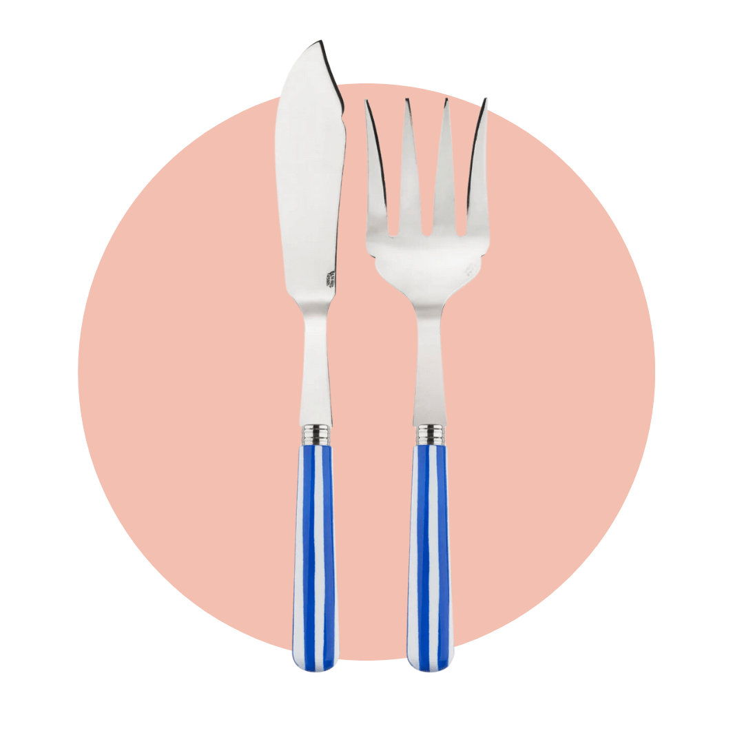 A large serving fork and knife with vertical blue and white stripes on a light pink circle graphic