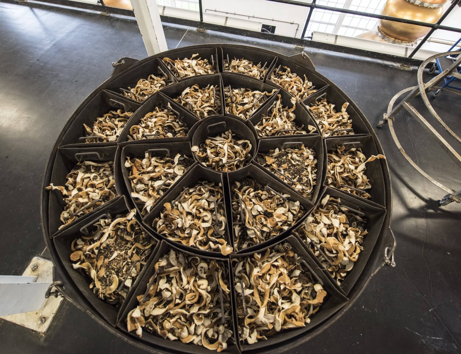 copper baskets full of dried botanicals