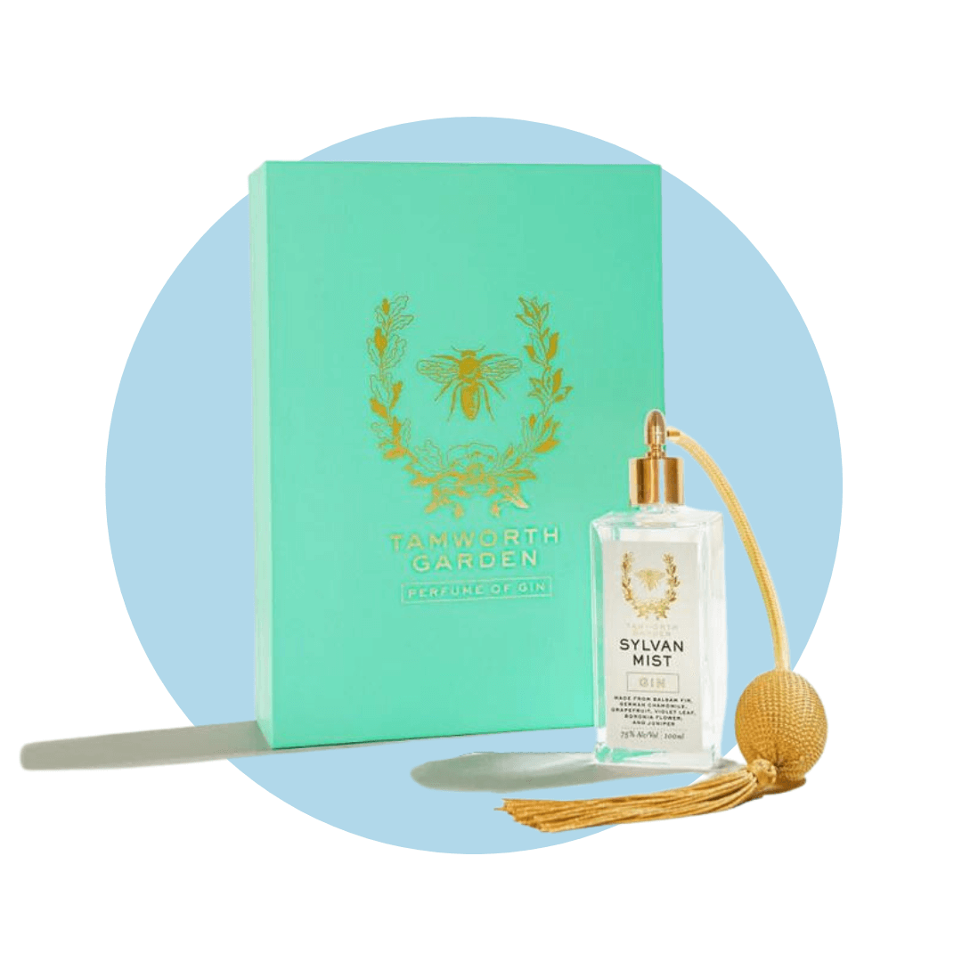 A turquoise box with an old-fashioned perfume bottle