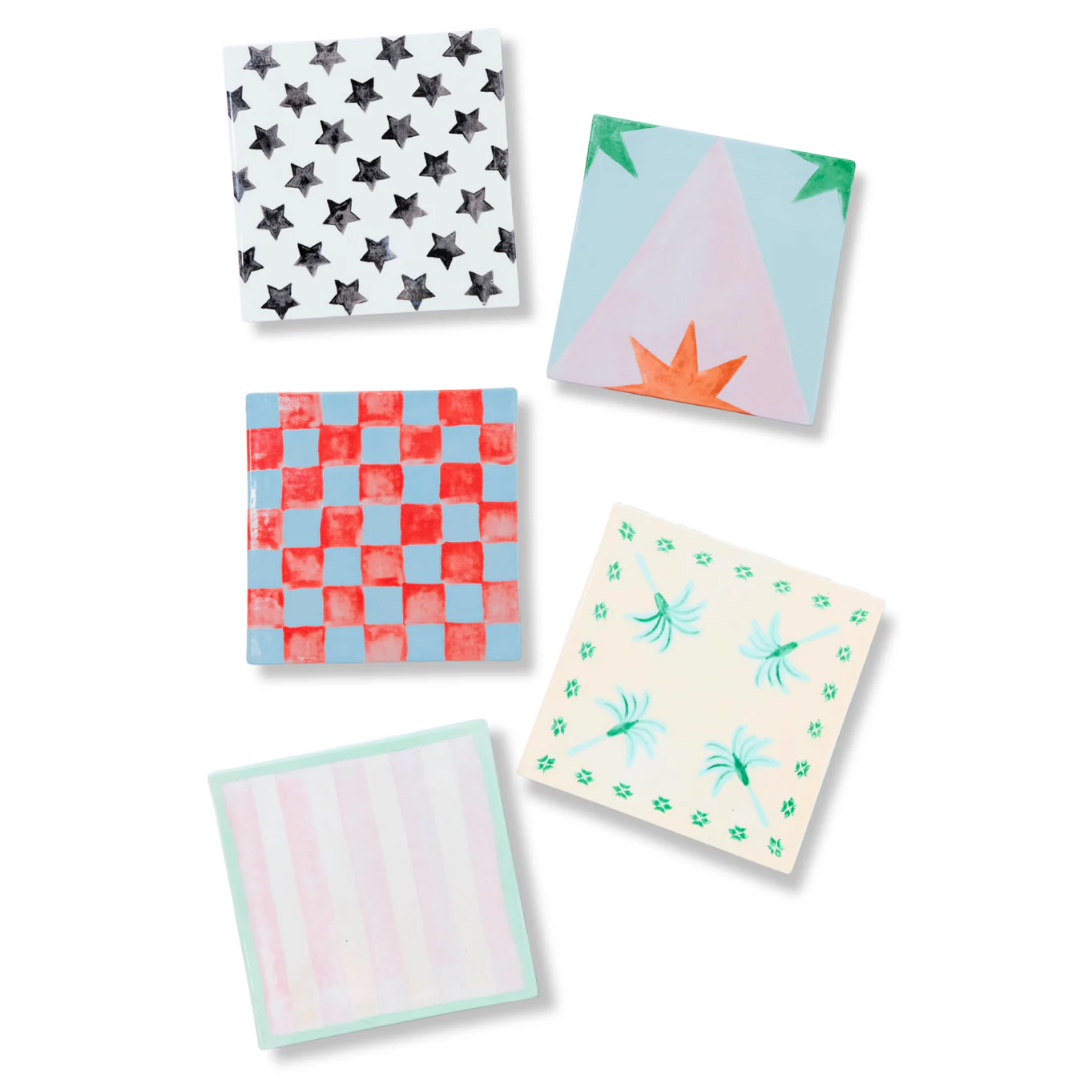 Five colourful tile-shaped dessert plates. 
