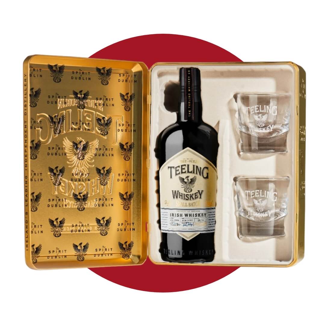 A gold box with whisky and two glasses on a dark red circle graphic