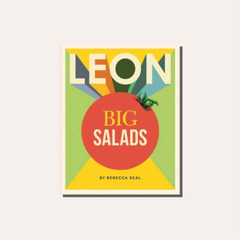 A colourful cookbook titled "Leon Big Salads" in a light tan frame