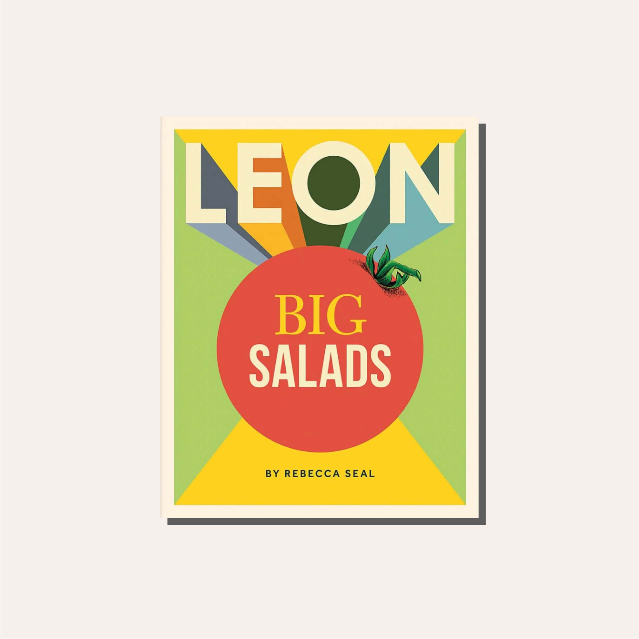 A colourful cookbook titled "Leon Big Salads" in a light tan frame