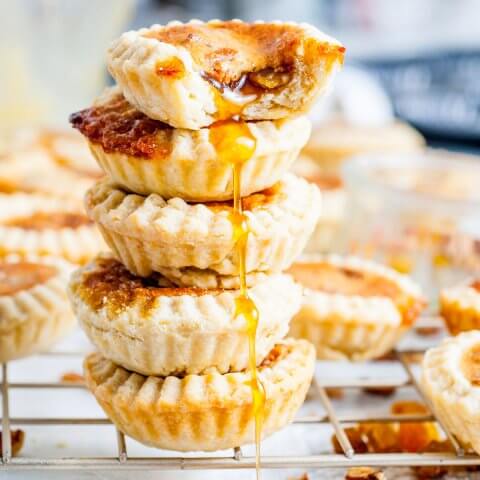 A stack of butter tarts on a drying rack