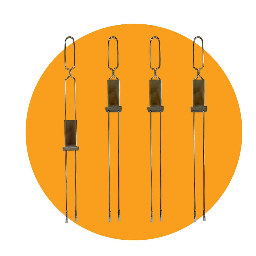 Four skewers with sliders at the top on an orange circle graphic
