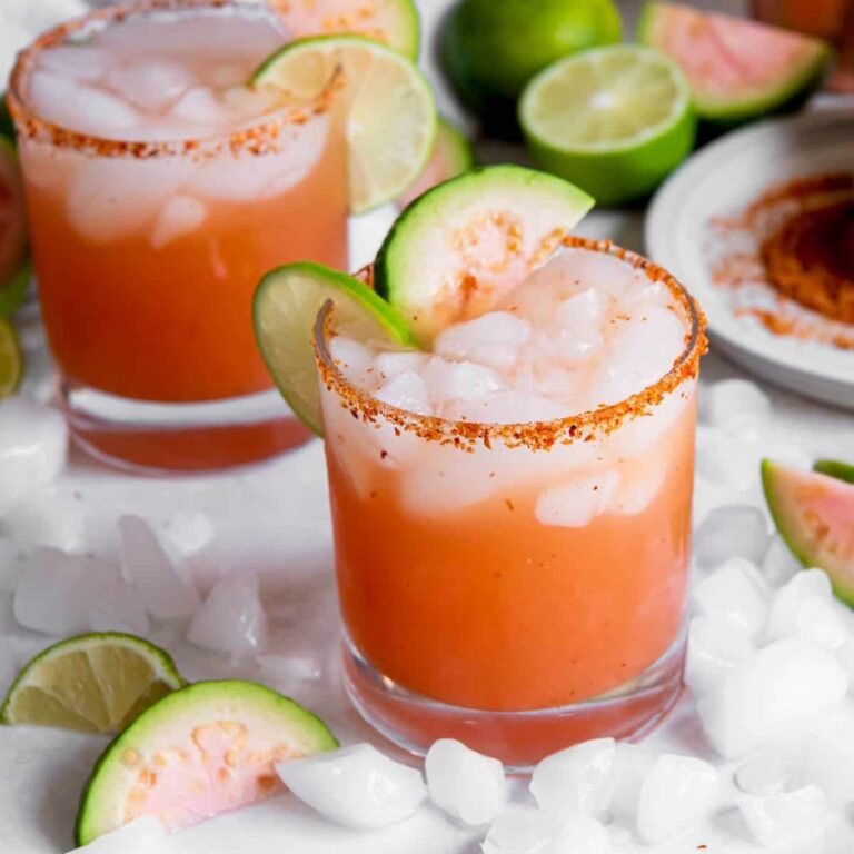 Guava margarita served over ice with fresh guava garnish.