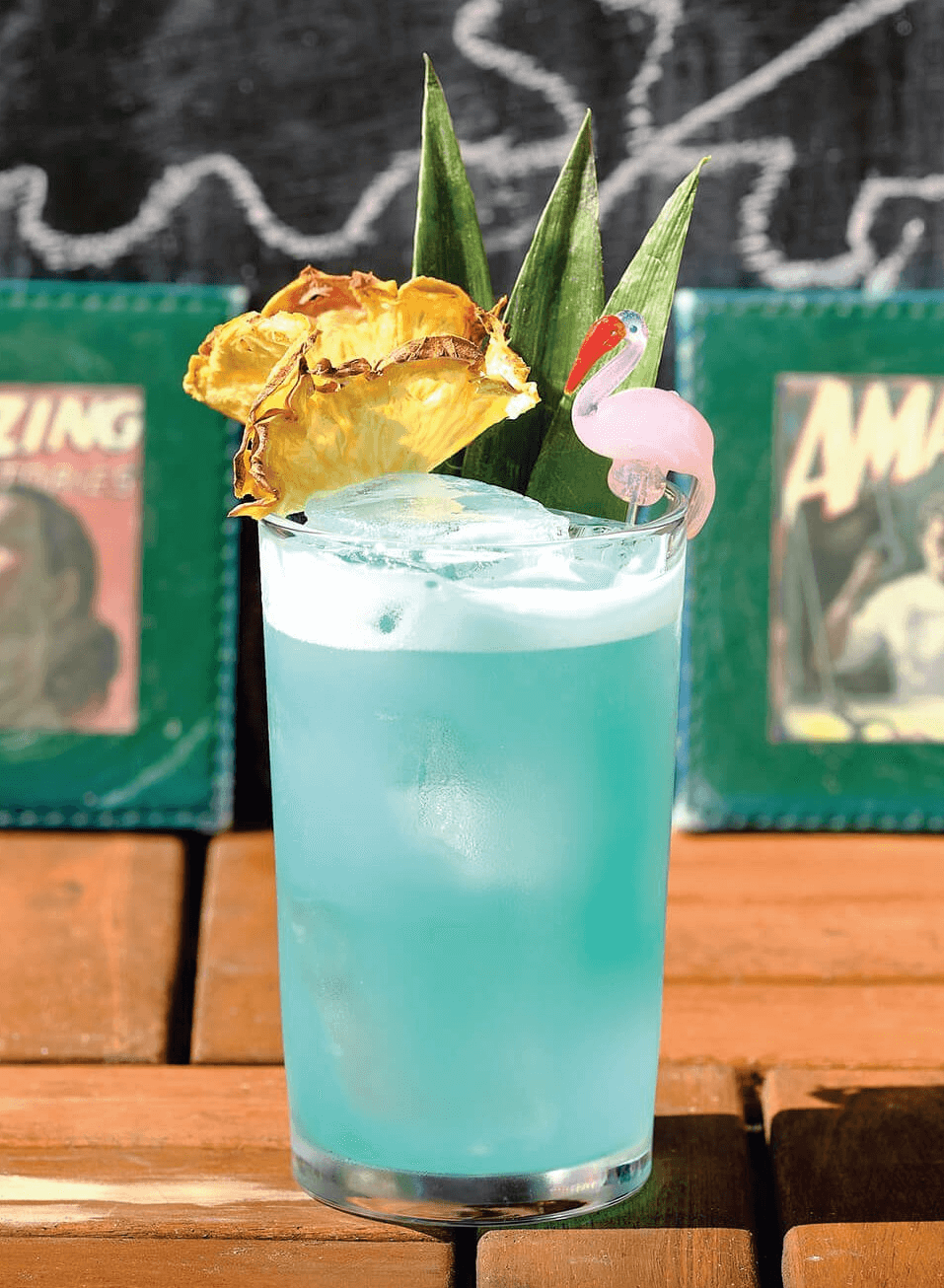 A blue Margarita garnished with pineapple