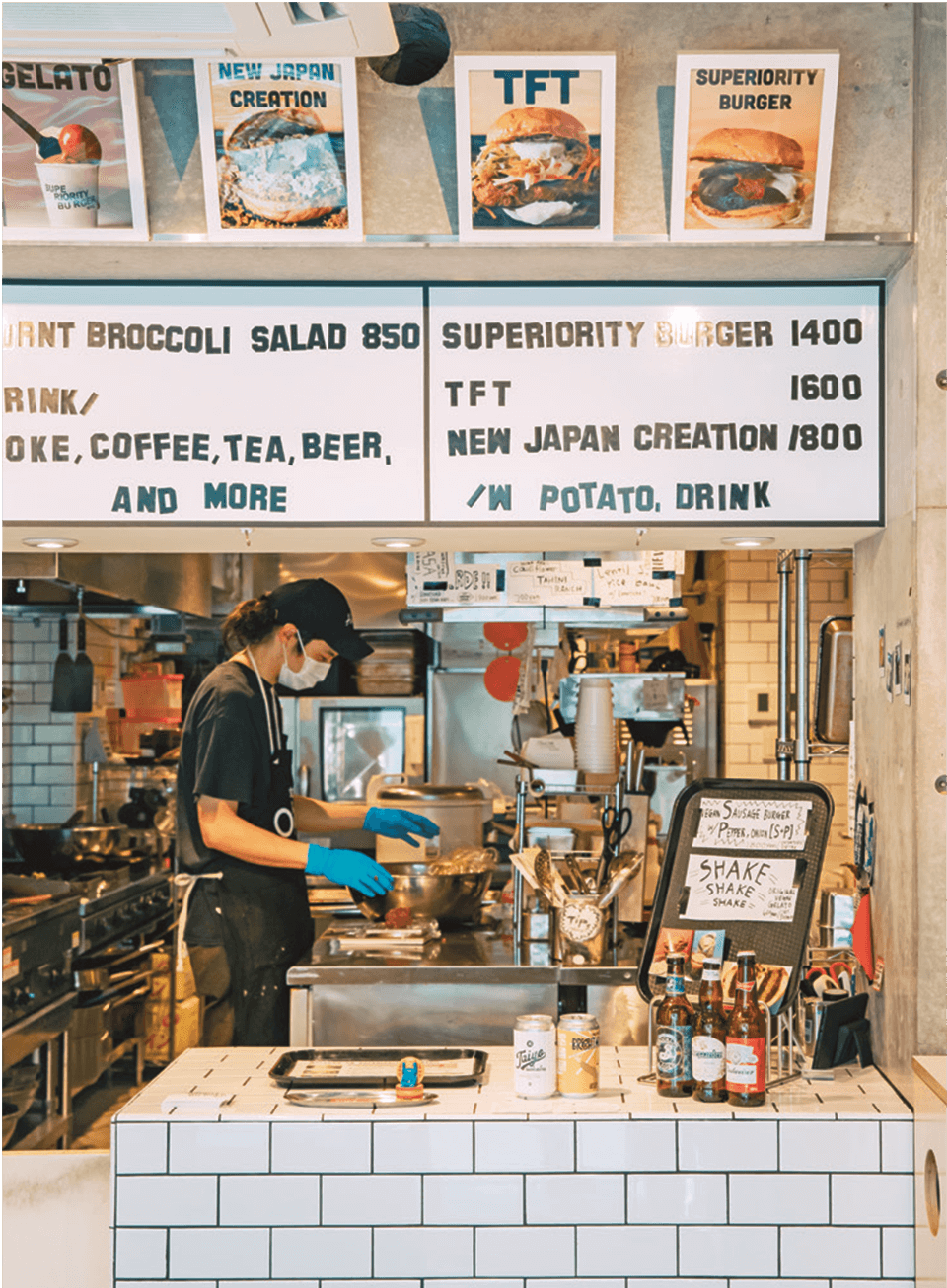 A view of a person behind a hamburger store counter