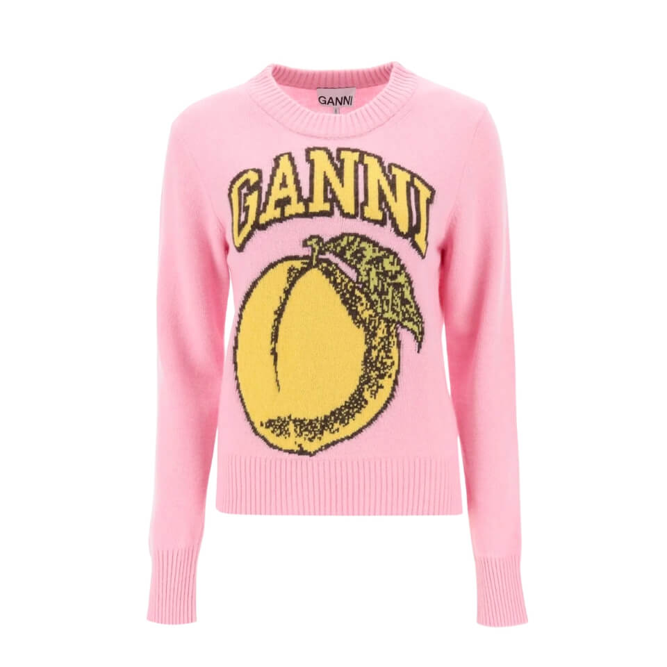 A pink sweater with the word "Ganni" in yellow varsity letters and a peach graphic