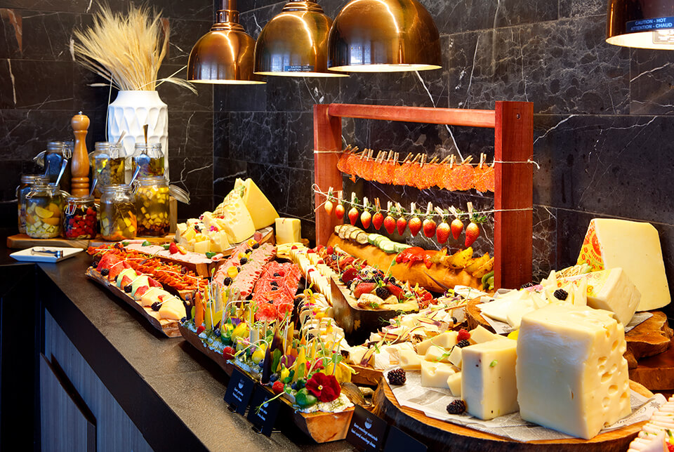 A table set with various food items buffet-style
