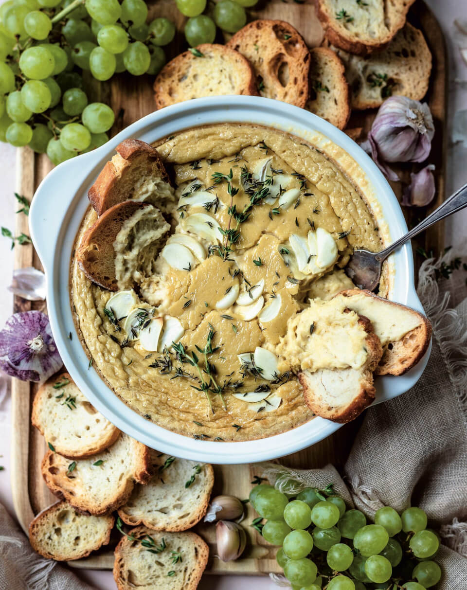 overhead shot of white bowl with baked cheese