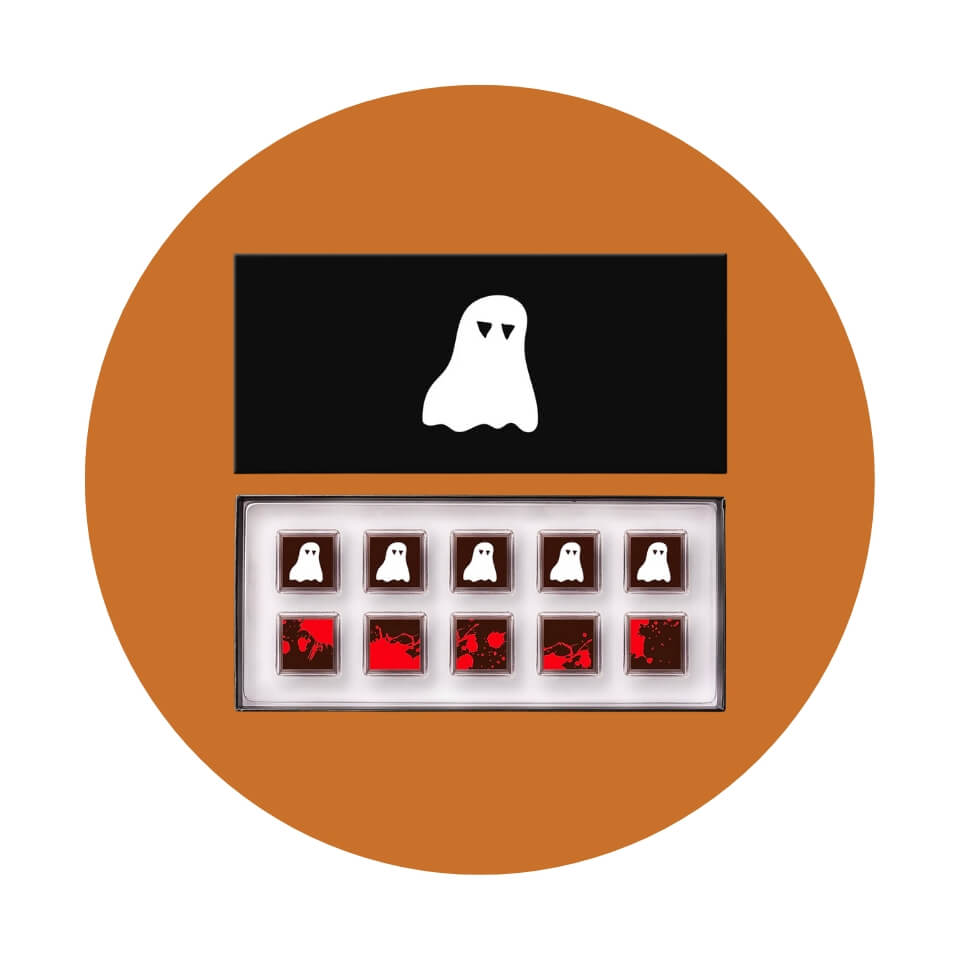 A box of chocolates with a small ghost and blood spatter decorations on an orange circle