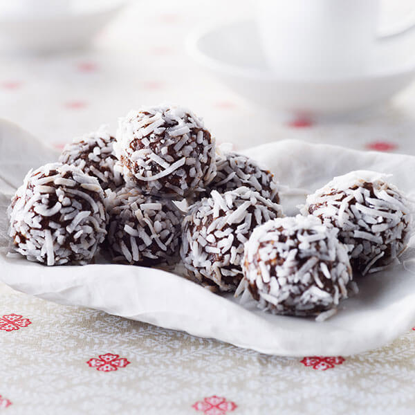 A white plate with chocolate truffles
