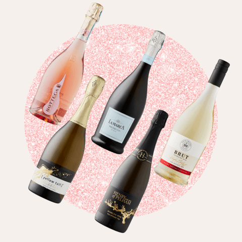 five bottles of wine on pink circle