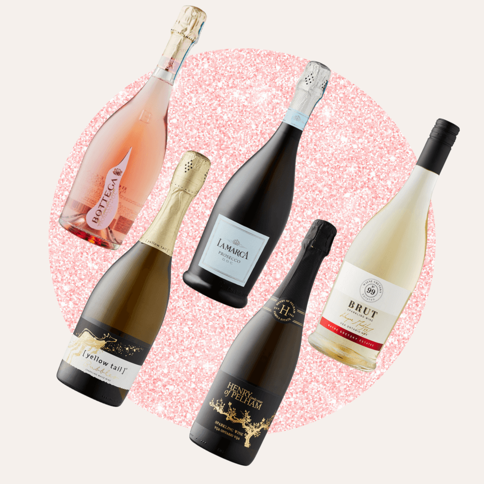 five bottles of wine on pink circle