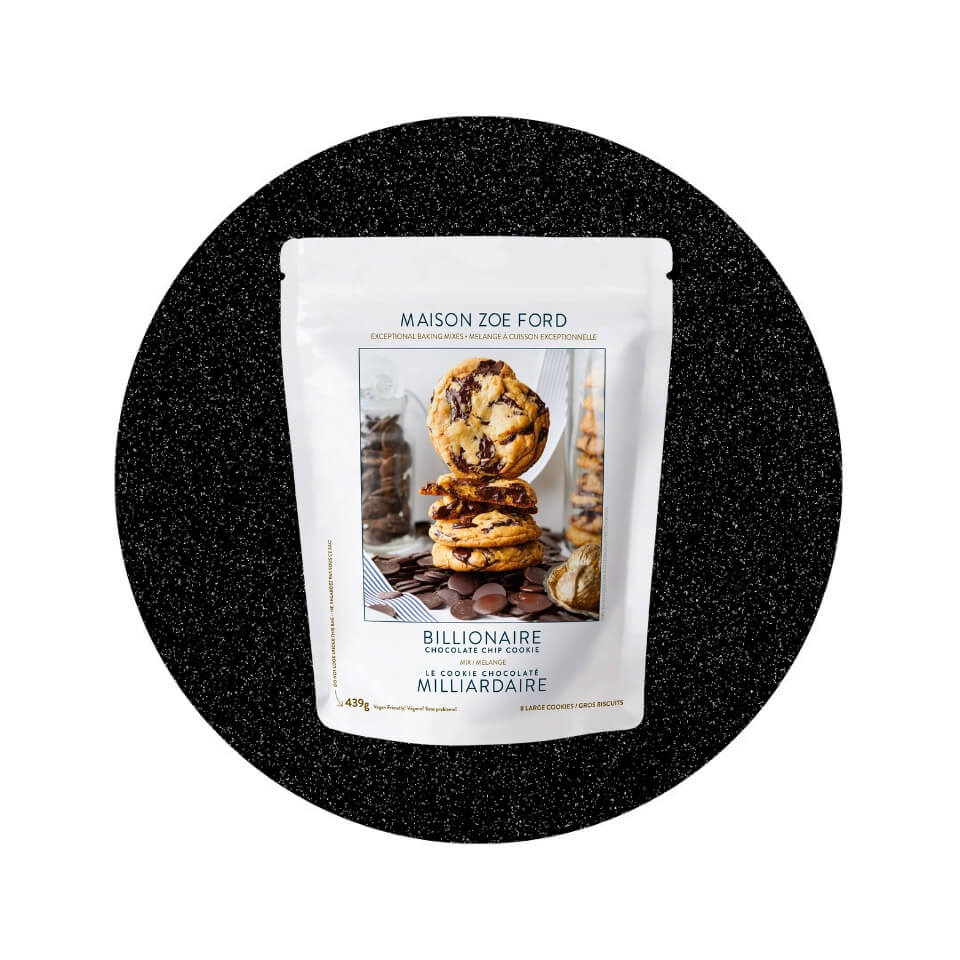 A white bag with a picture of chocolate chip cookies in a sparkly black circle