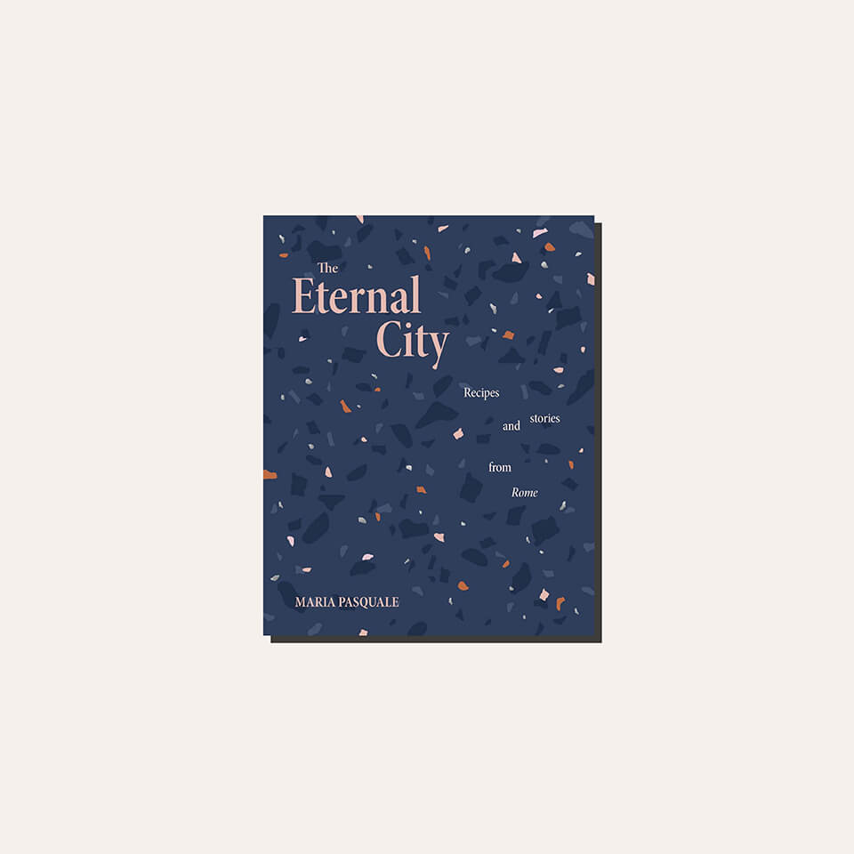 A blue and pink cookbook cover in a light frame.