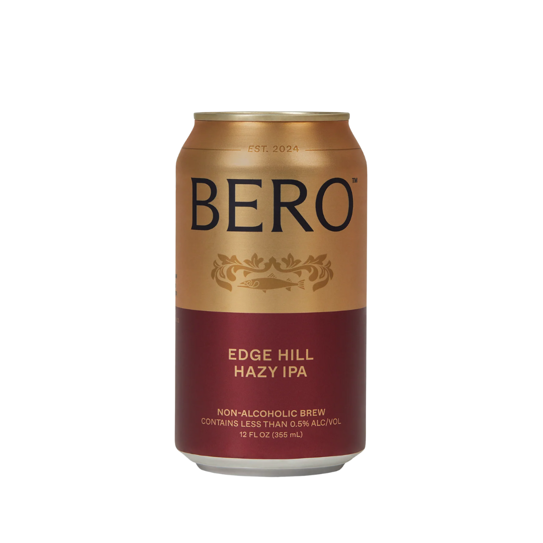 A gold and burgundy can of non-alcoholic beer. 