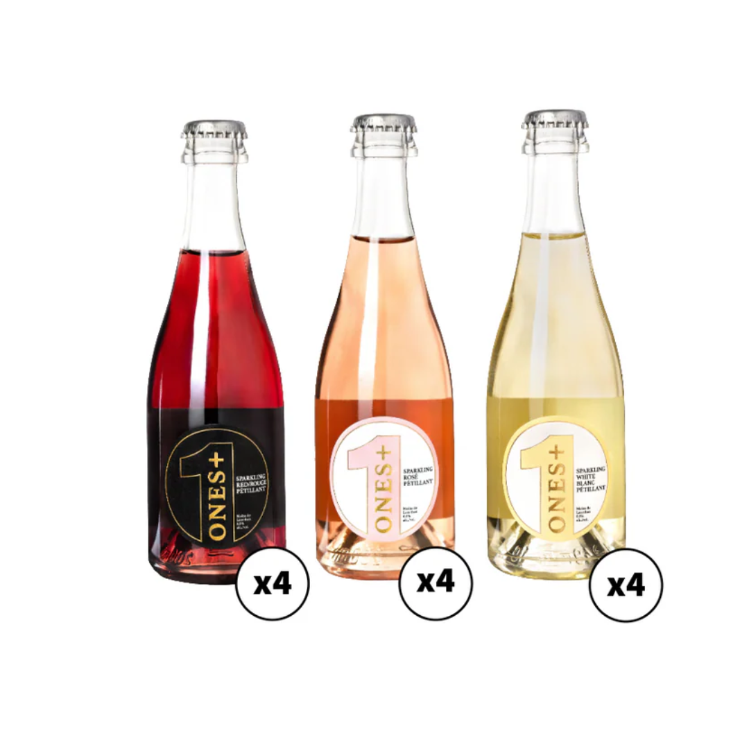 Three glass bottles, one filled with a dark red liquid, a light orange liquid and a light yellow liquid. 