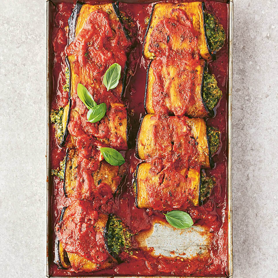 A tray with baked eggplant and tomato sauce